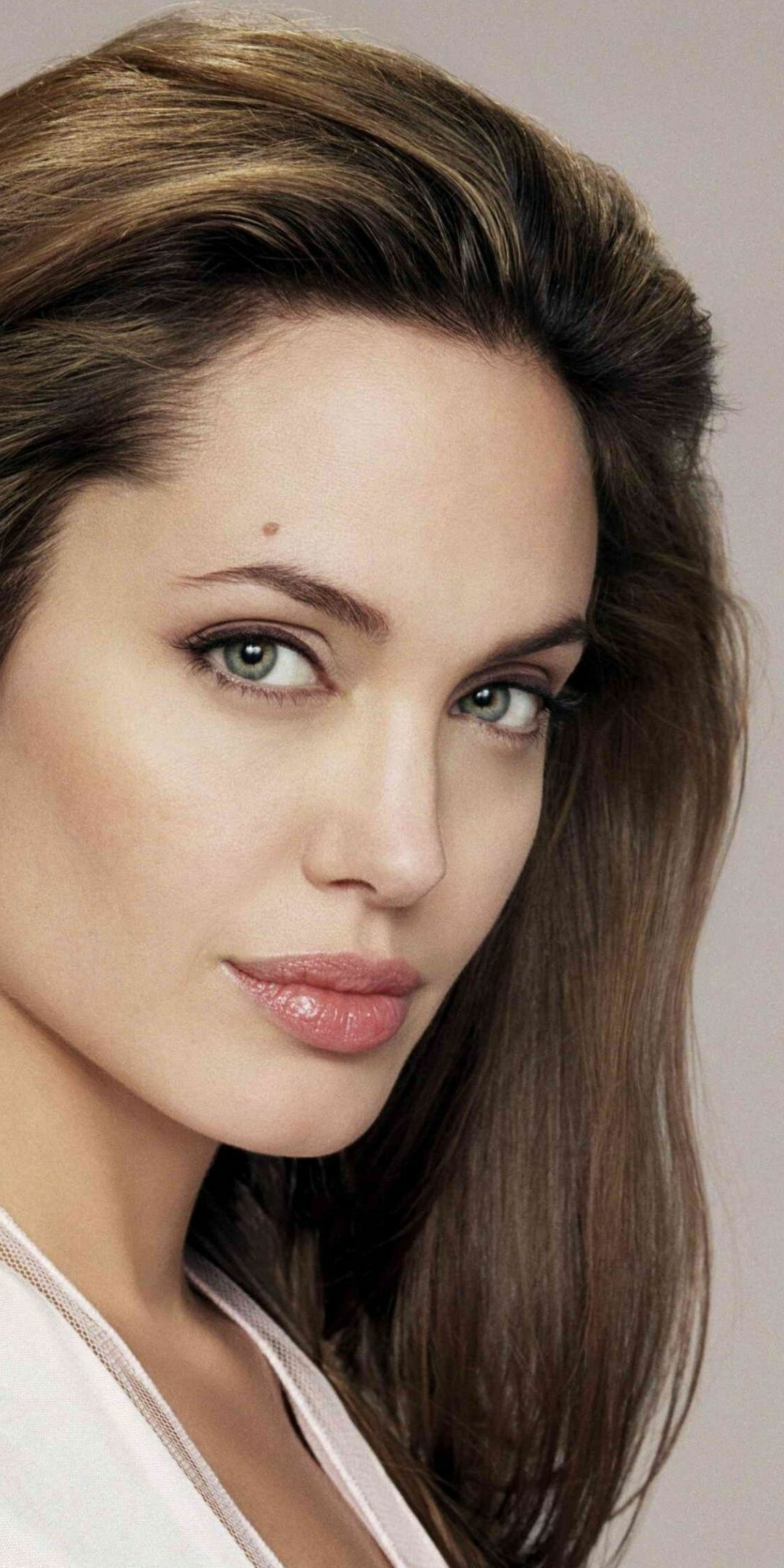 Angelina Jolie, Captivating eyes, Mysterious aura, Enchanting gaze, 1080x2160 HD Phone