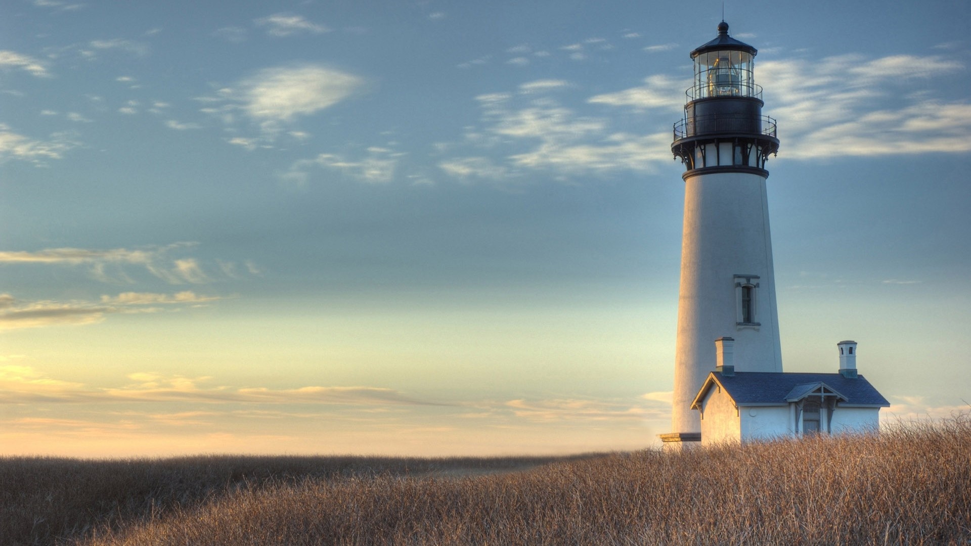 Solitary sentinel, Secluded coastline, Moody atmosphere, Silent guardian, 1920x1080 Full HD Desktop