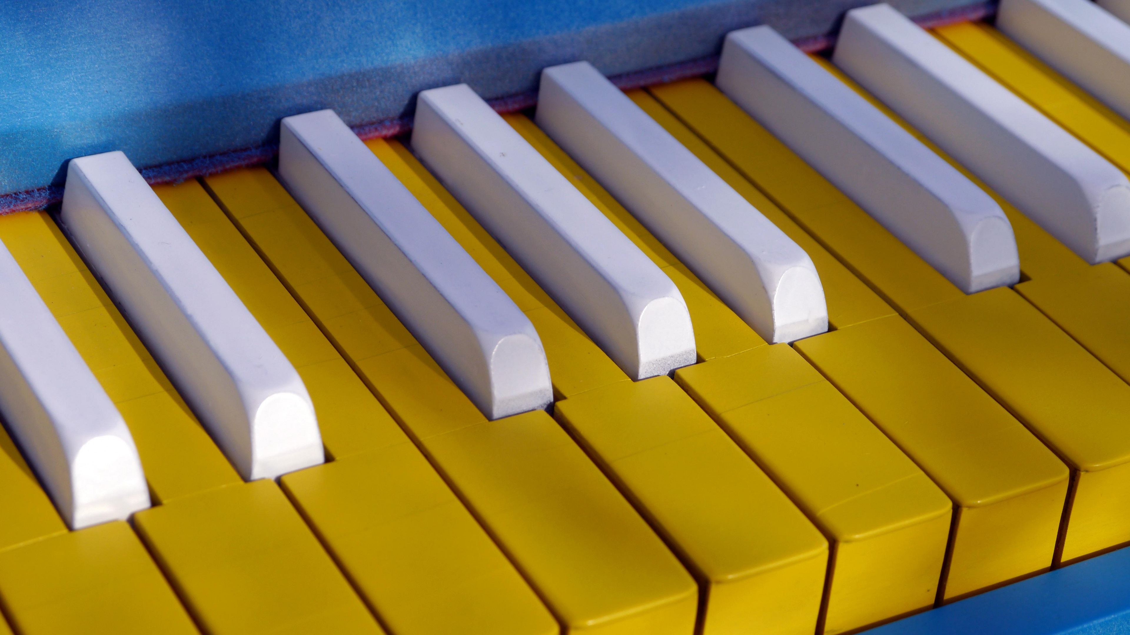 yellow piano keys, vibrant music, widescreen wallpaper, uplifting vibes, 3840x2160 4K Desktop