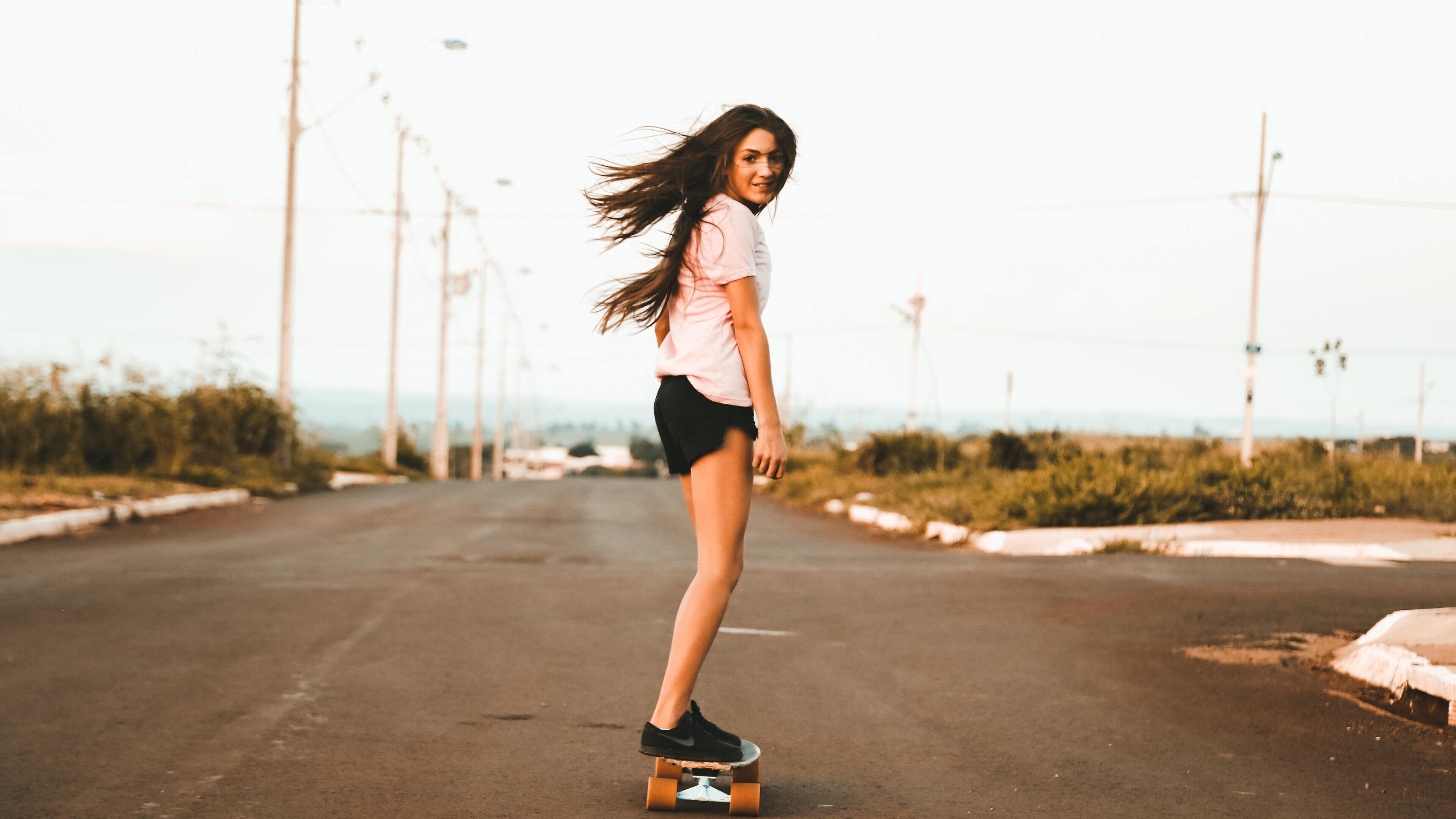 Woman riding skateboard, Urban skate lifestyle, Road adventure, 5K photography, 3840x2160 4K Desktop