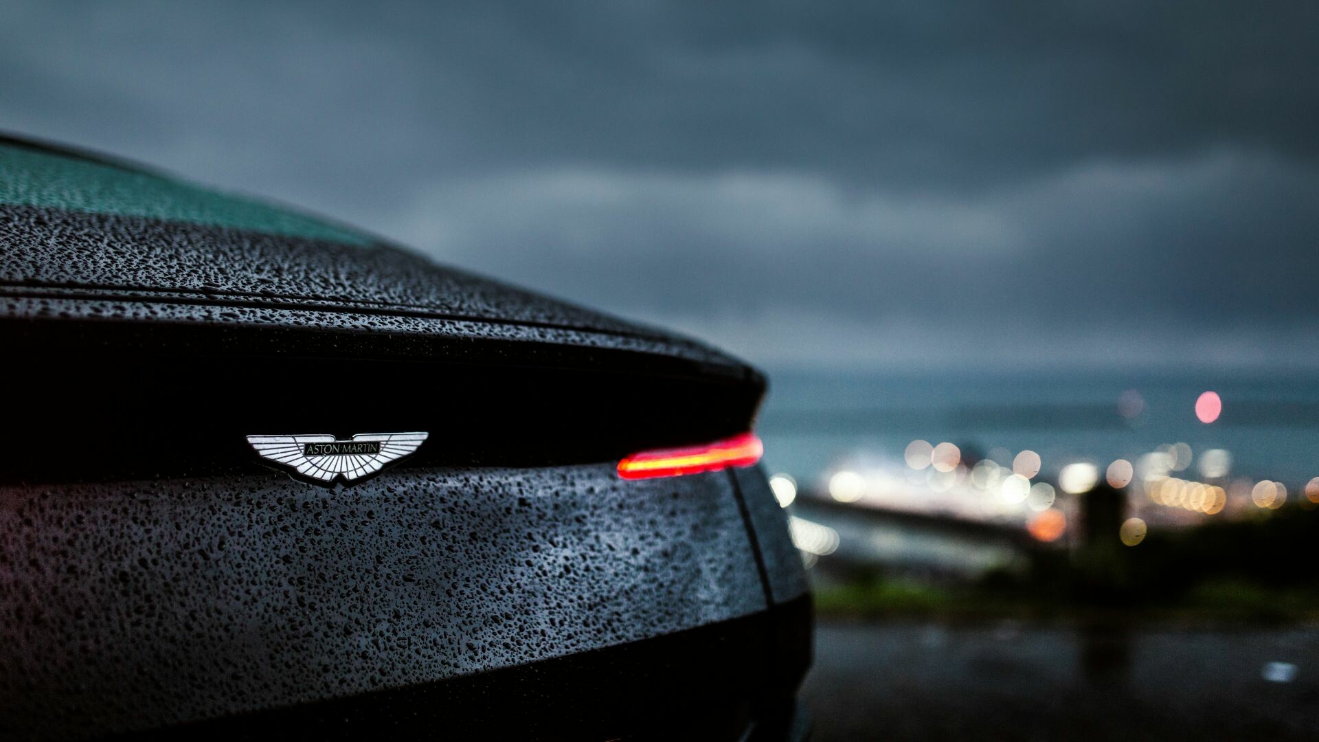 Aston Martin DB11, Sleek and stylish, Striking rear taillight, Rain-soaked beauty, 1920x1080 Full HD Desktop