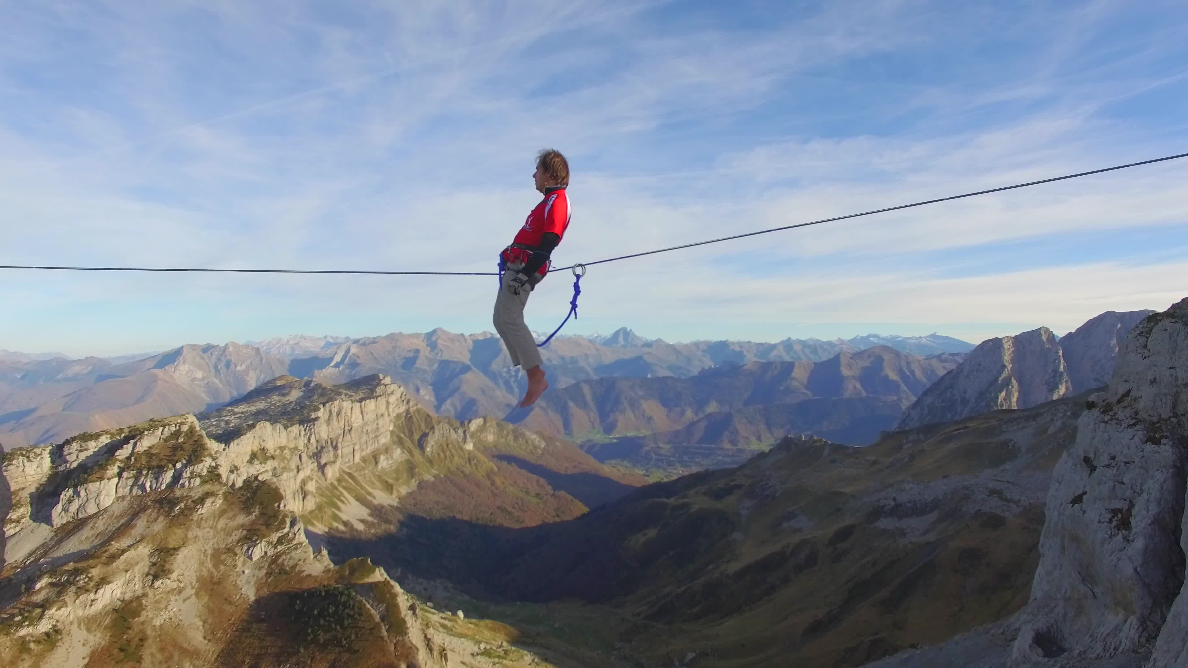 Aerial view of balancing on a slackline, Mountain tightrope, Fearless balance, Elevated thrill, 3840x2160 4K Desktop