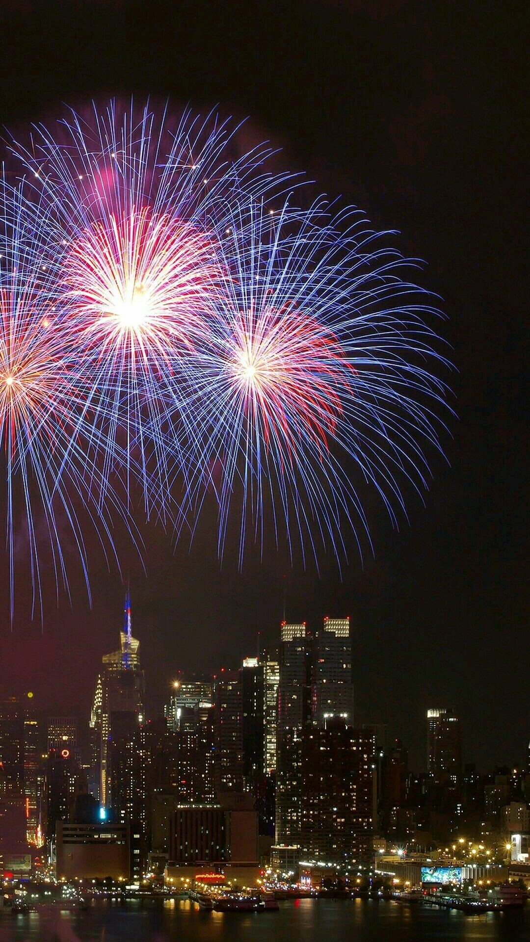 Fireworks extravaganza, New Year's celebration, Vibrant colors, Joyful moments, 1080x1920 Full HD Phone