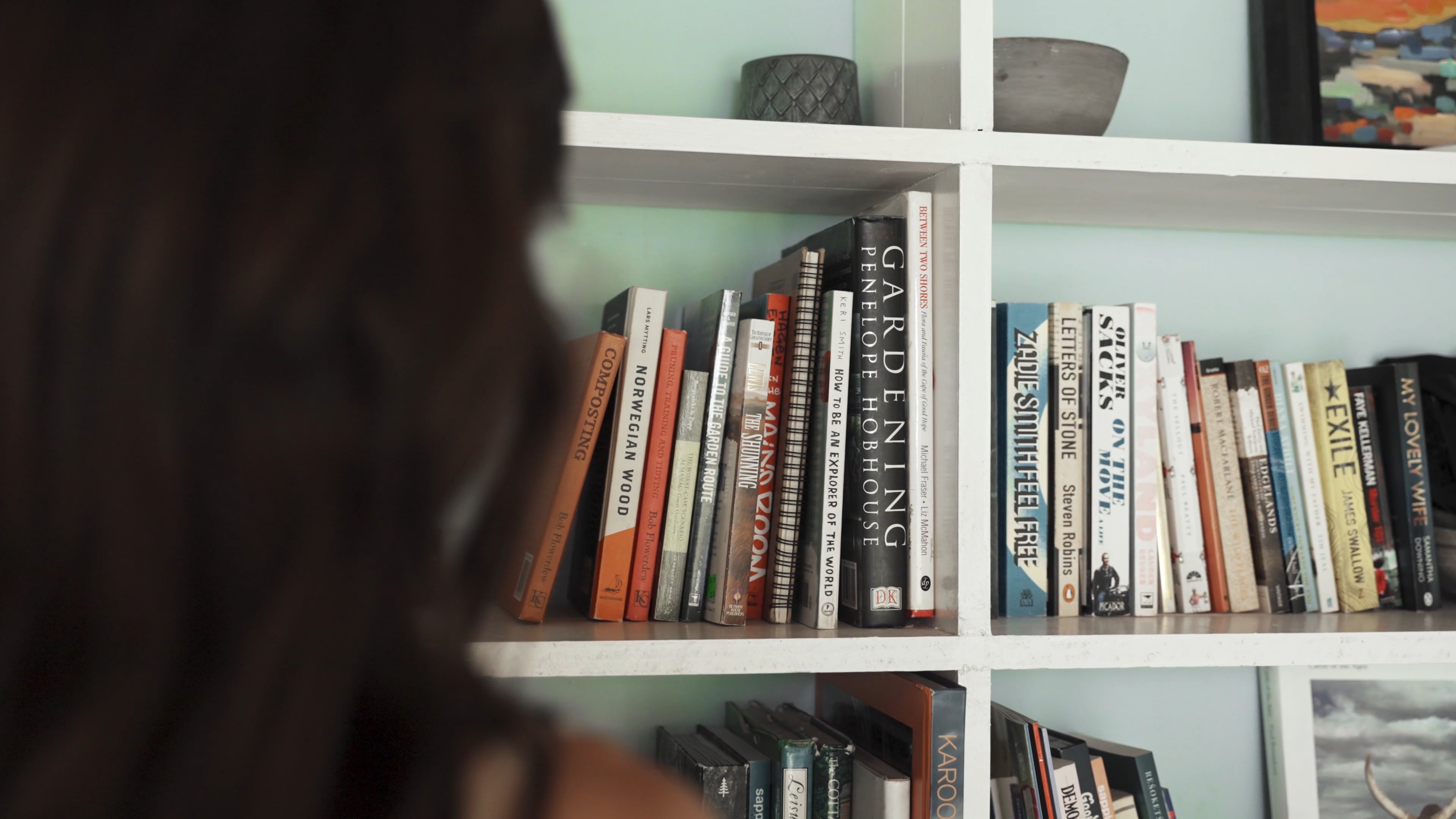 Person getting a book from a shelf, Library visit, Book browsing, Reading materials, 3840x2160 4K Desktop