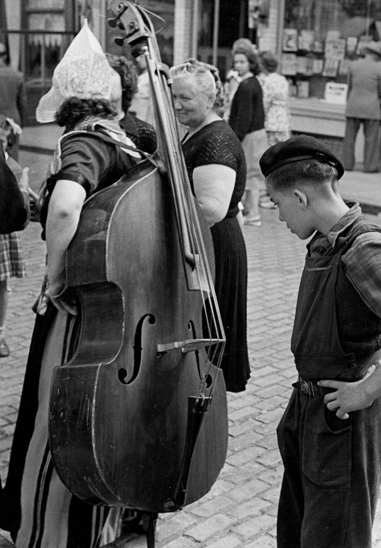 Woman carrying double bass, Strong and talented, Impressive skill, Double bassist, 1570x2250 HD Phone