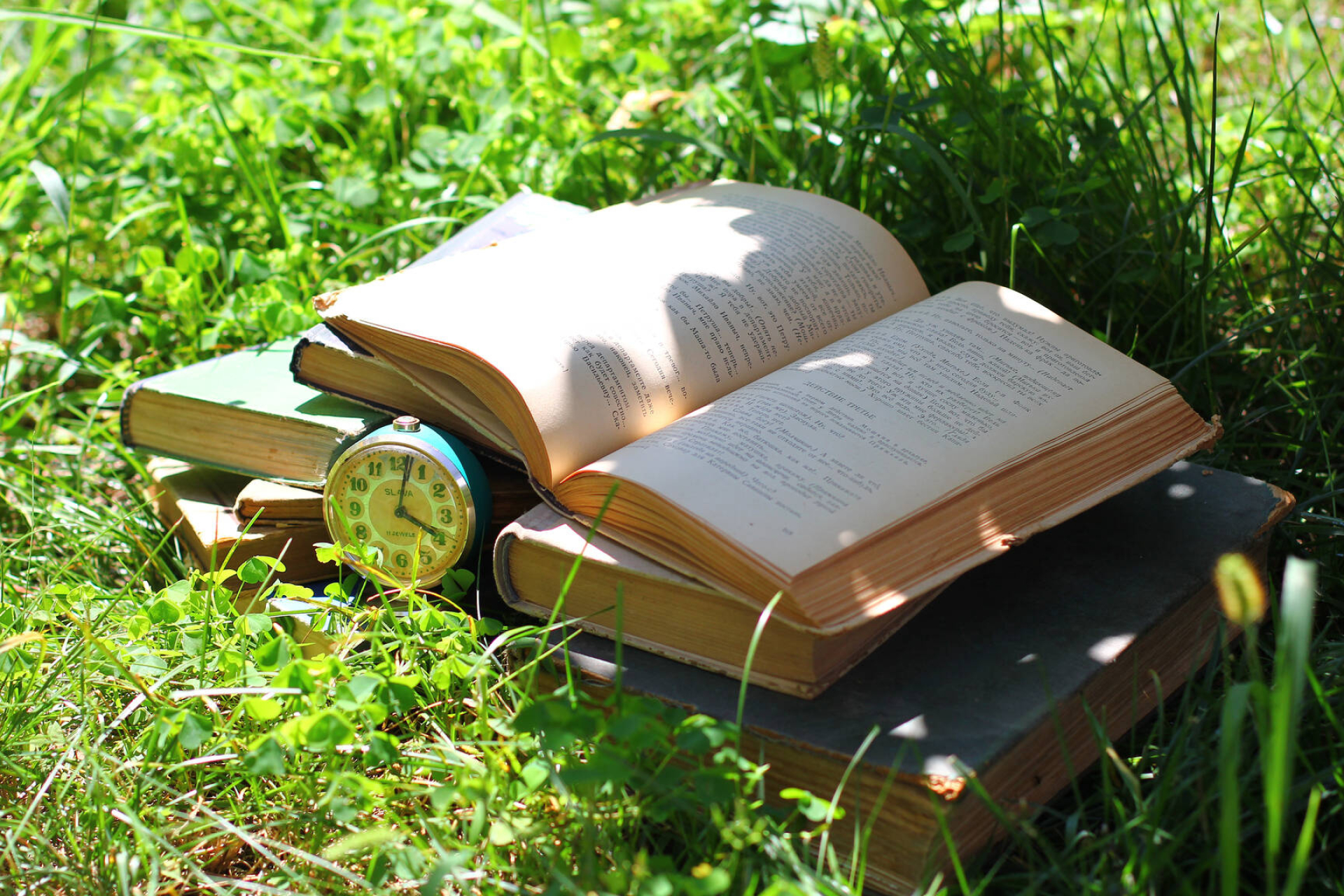 Books on grass, Reading in nature, Serene imagery, Relaxing book moments, 1920x1280 HD Desktop