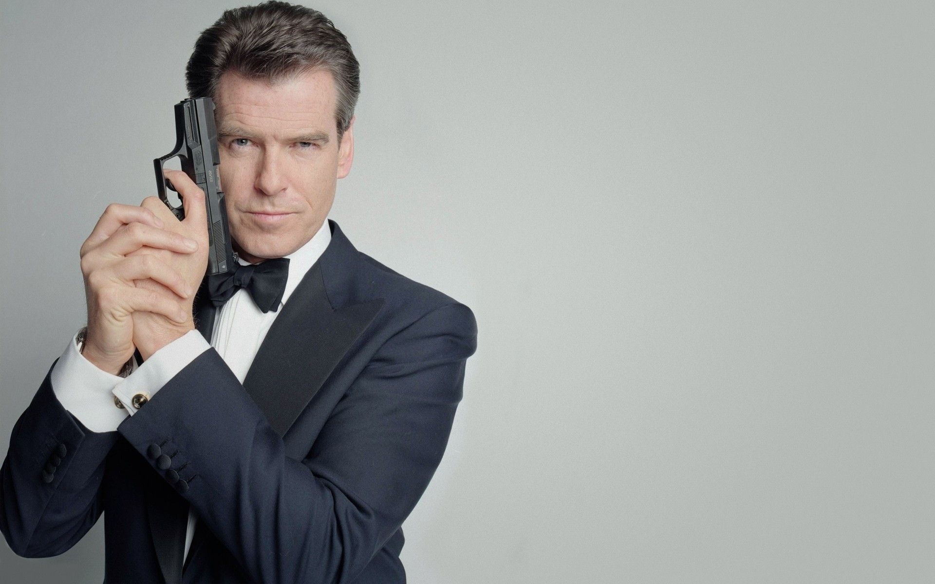 Pierce Brosnan, Dashing spy, Captivating backgrounds, Iconic images, 1920x1200 HD Desktop