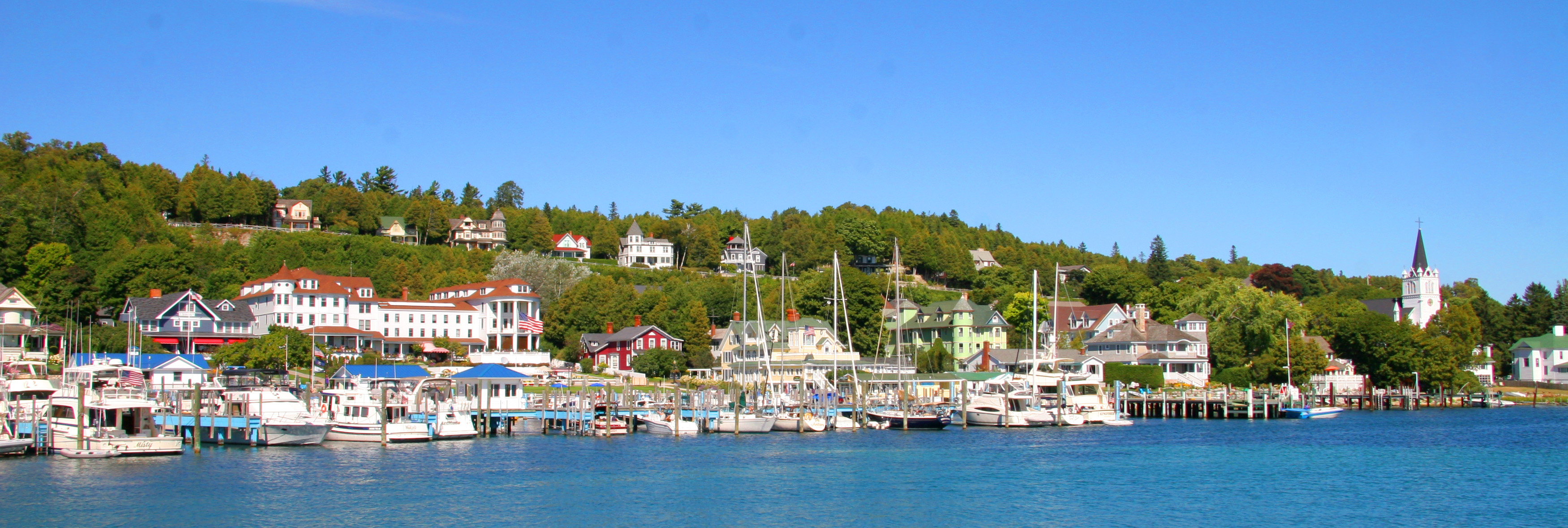 Mackinac Island group travel, Upper Peninsula adventure, Island exploration, Memorable experiences, 3510x1180 Dual Screen Desktop