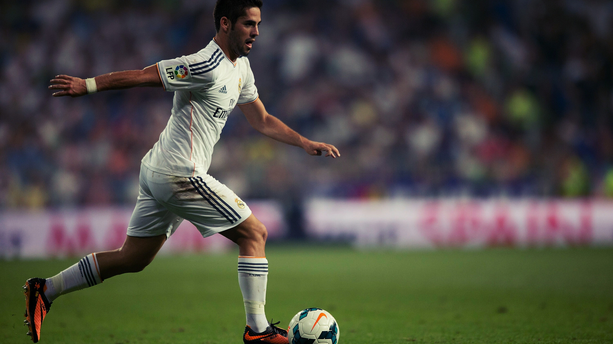 Real Madrid stadium, Isco's cleats, Sports field scenery, Fly Emirates sponsorship, 2560x1440 HD Desktop