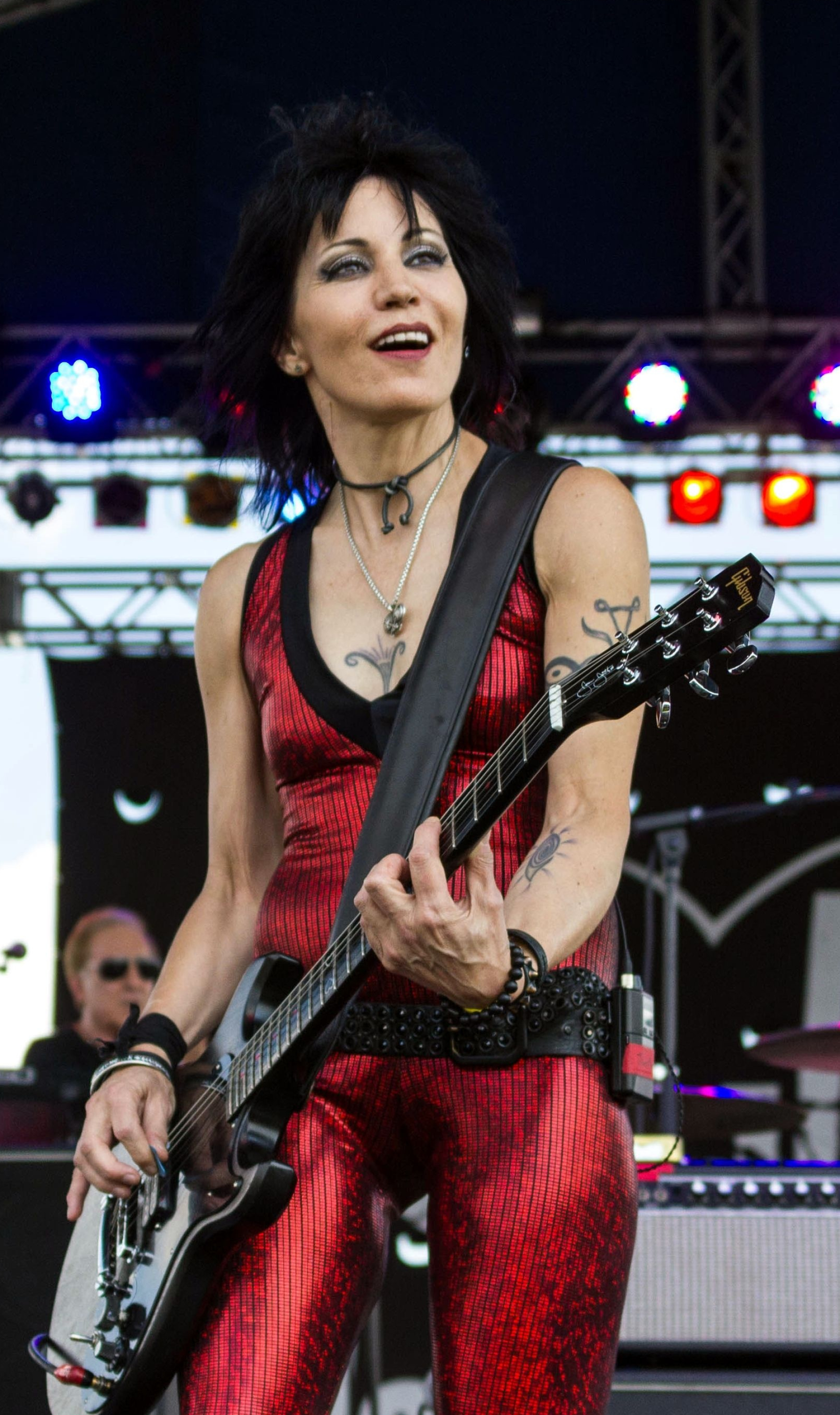 Joan Jett, Dynamic stage presence, Legendary rock anthems, Timeless icon, 1790x3000 HD Phone