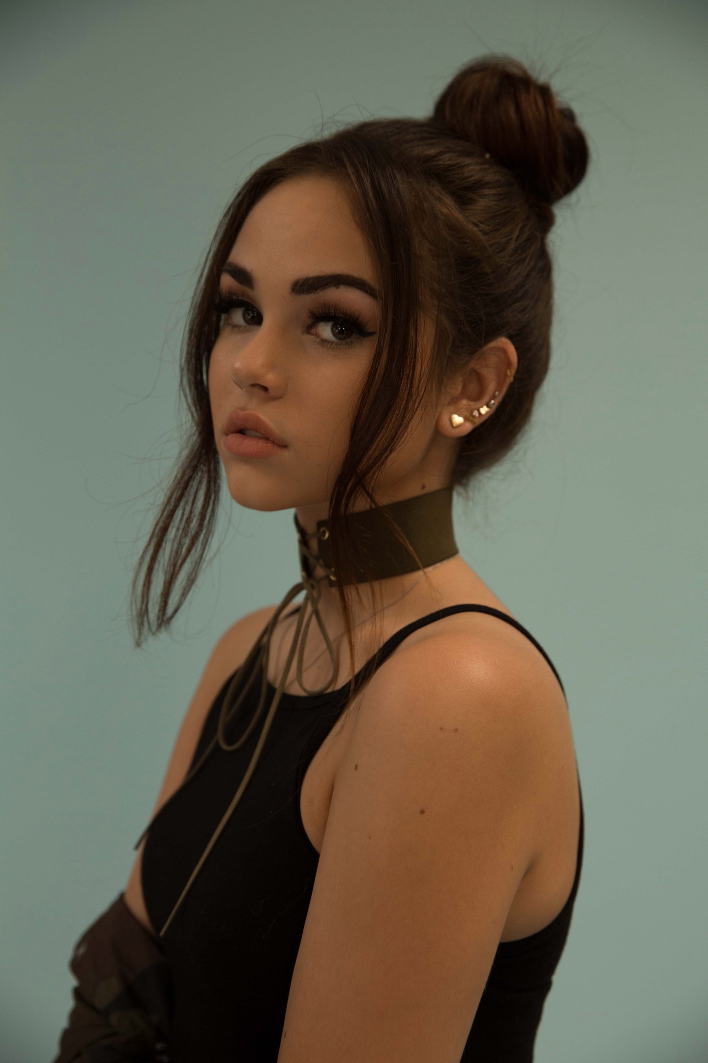 women, model, brunette, straight hair, looking at viewer, bare shoulders, eyelashes, dark eyes, Maggie Lindemann, hairbun, choker, earring, vertical, simple background, black clothing | Wallpaper 1440x2160