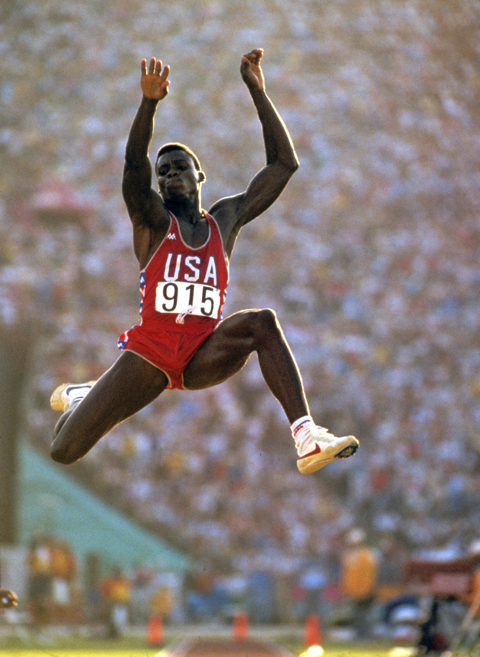 Carl Lewis, Long Jump Wallpaper, 1920x2630 HD Phone